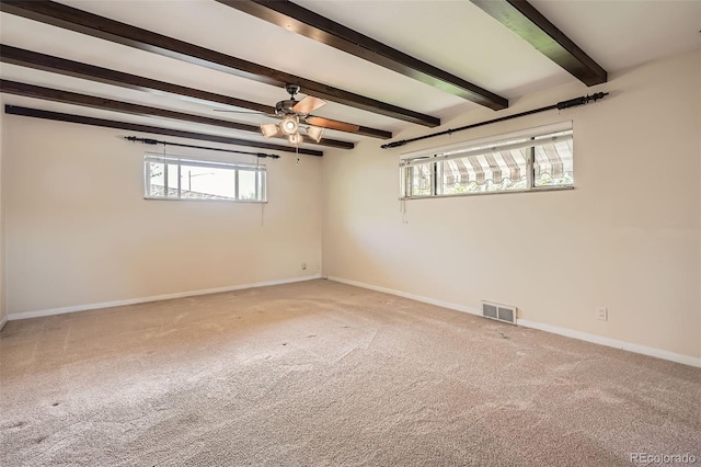 4490 Balsam St, Wheat Ridge, CO 80033 - carpeted spare room featuring healthy amount of natural light, beamed ceiling, baseboards, and a ceiling fan