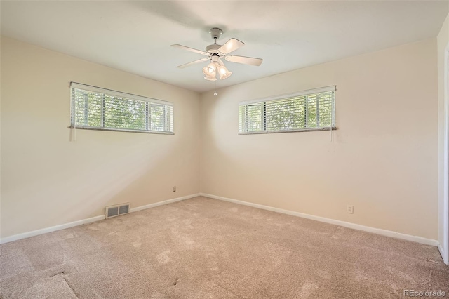 4490 Balsam St, Wheat Ridge, CO 80033 - spare room featuring plenty of natural light, light colored carpet, a ceiling fan, and baseboards