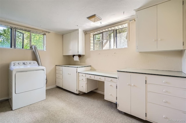 4490 Balsam St, Wheat Ridge, CO 80033 - laundry area with washer / dryer, cabinet space, healthy amount of natural light, and light colored carpet
