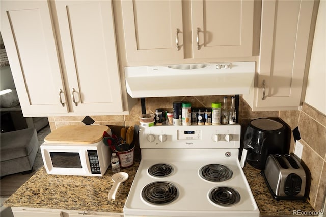 1358 S Irving St Unit A9, Denver, CO 80219 - kitchen featuring white appliances, ventilation hood, white cabinetry, and tasteful backsplash