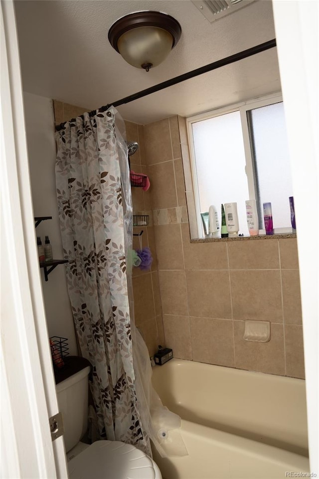 1358 S Irving St Unit A9, Denver, CO 80219 - bathroom with toilet and shower / tub combo with curtain