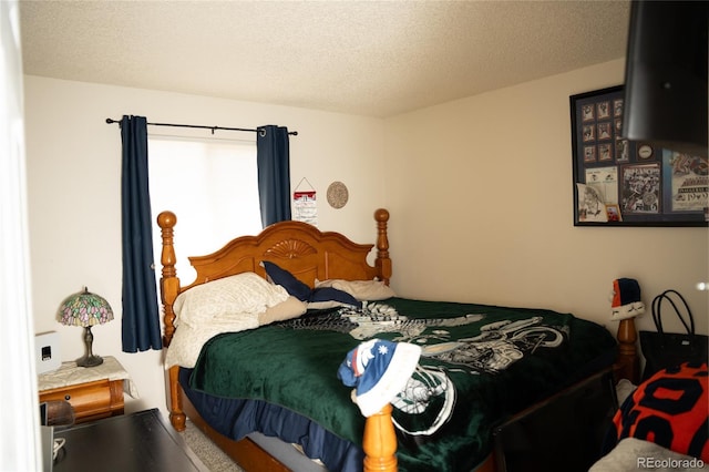 1358 S Irving St Unit A9, Denver, CO 80219 - bedroom featuring a textured ceiling