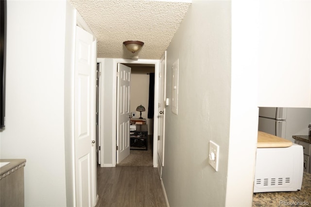 1358 S Irving St Unit A9, Denver, CO 80219 - hall with dark wood-type flooring and a textured ceiling