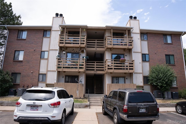 1358 S Irving St Unit A9, Denver, CO 80219 - view of apartment building / complex featuring uncovered parking