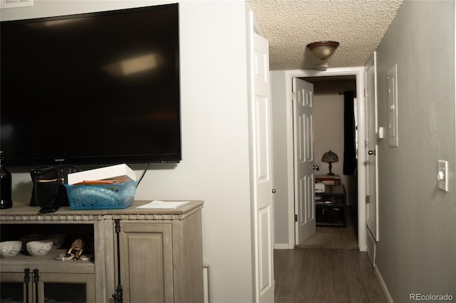 1358 S Irving St Unit A9, Denver, CO 80219 - corridor featuring dark wood-type flooring and a textured ceiling