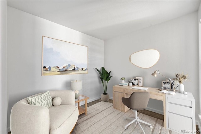 office area with light hardwood / wood-style floors