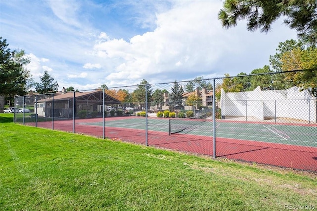 view of sport court featuring a yard