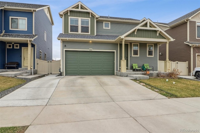 view of front of home featuring a gate, fence, board and batten siding, and a porch