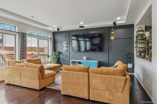 living area featuring baseboards, visible vents, recessed lighting, and dark wood-type flooring