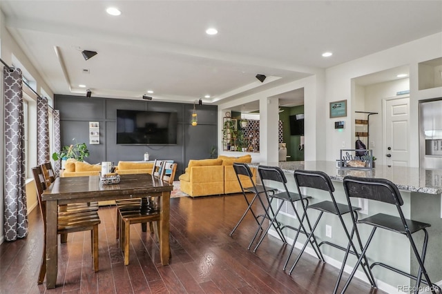 dining room featuring dark wood-style flooring and recessed lighting