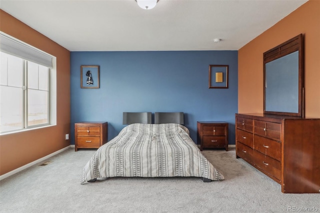 carpeted bedroom with baseboards