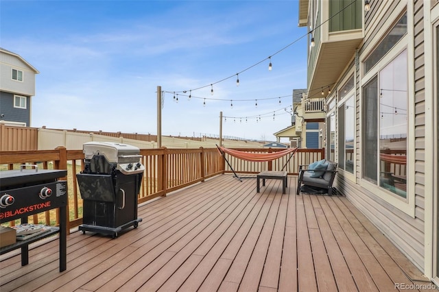 deck with fence and area for grilling