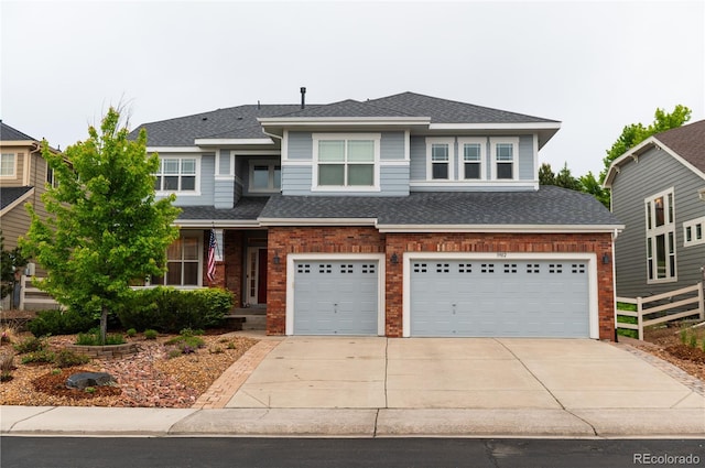 3902 Eagle Tail Ln, Castle Rock, CO 80104 - view of front of house with concrete driveway, a garage, brick siding, and a shingled roof