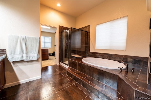 3902 Eagle Tail Ln, Castle Rock, CO 80104 - bathroom featuring a garden tub, a shower stall, tile patterned floors, and vanity