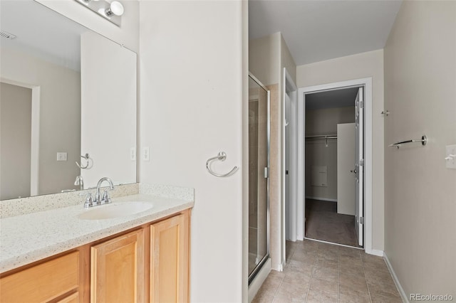 8399 Stonybridge Cir, Highlands Ranch, CO 80126 - full bath with a shower stall, vanity, a spacious closet, and tile patterned flooring