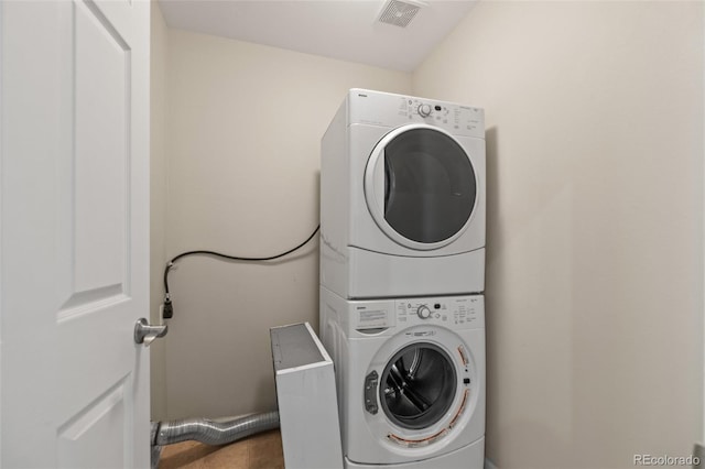 8399 Stonybridge Cir, Highlands Ranch, CO 80126 - laundry room featuring estacked washer and dryer