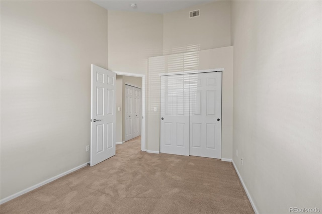 8399 Stonybridge Cir, Highlands Ranch, CO 80126 - unfurnished bedroom featuring a high ceiling and light colored carpet