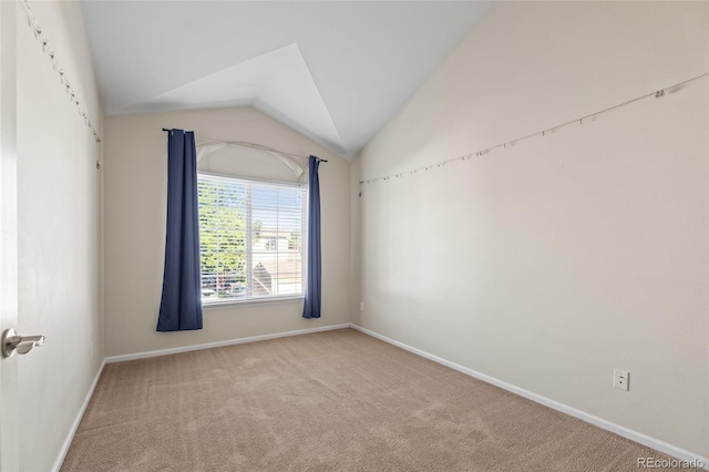 8399 Stonybridge Cir, Highlands Ranch, CO 80126 - spare room featuring carpet flooring and vaulted ceiling