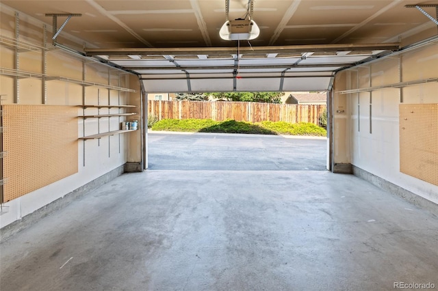 8399 Stonybridge Cir, Highlands Ranch, CO 80126 - garage with a garage door opener and baseboards