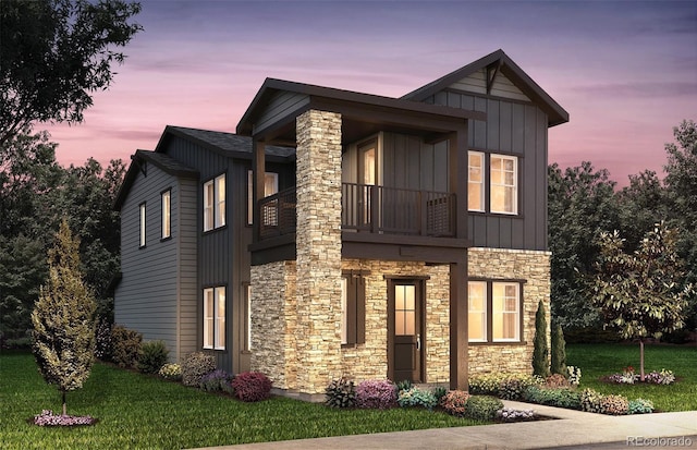 view of front of home featuring a balcony, a yard, board and batten siding, and stone siding