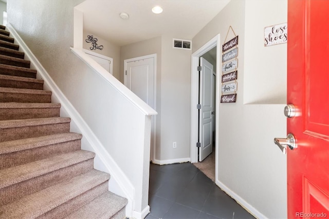 9300 E Florida Ave Unit 1107, Denver, CO 80247 - foyer entrance featuring baseboards, recessed lighting, visible vents, tile patterned flooring, and stairs