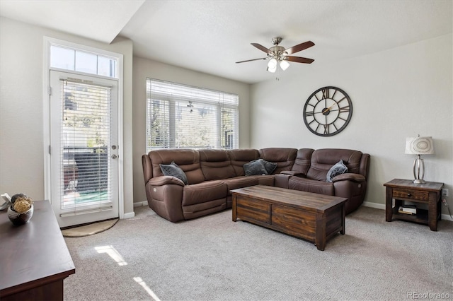 9300 E Florida Ave Unit 1107, Denver, CO 80247 - living room with a ceiling fan, carpet floors, and a healthy amount of sunlight