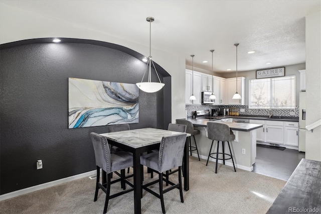 9300 E Florida Ave Unit 1107, Denver, CO 80247 - dining space featuring recessed lighting, baseboards, and light colored carpet