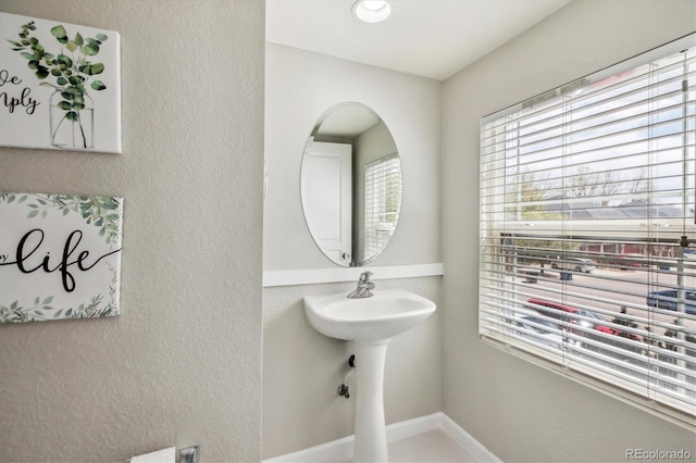 9300 E Florida Ave Unit 1107, Denver, CO 80247 - bathroom with baseboards