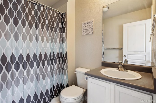 9300 E Florida Ave Unit 1107, Denver, CO 80247 - full bathroom featuring a textured wall, vanity, a shower with shower curtain, and toilet