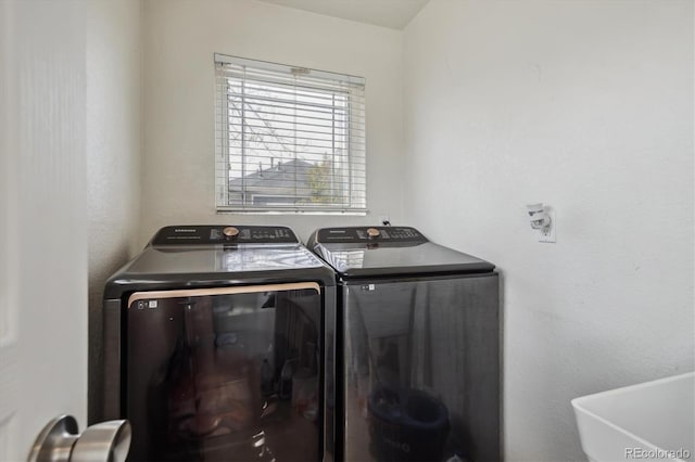 9300 E Florida Ave Unit 1107, Denver, CO 80247 - washroom featuring washer and dryer and laundry area