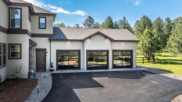 230 S Big Meadow Trl, Franktown, CO 80116 - exterior space featuring asphalt driveway and a garage