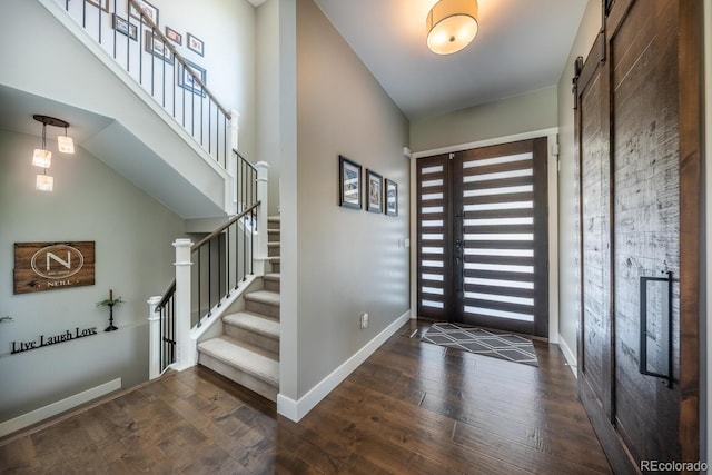 230 S Big Meadow Trl, Franktown, CO 80116 - foyer featuring hardwood / wood-style flooring, baseboards, and stairs