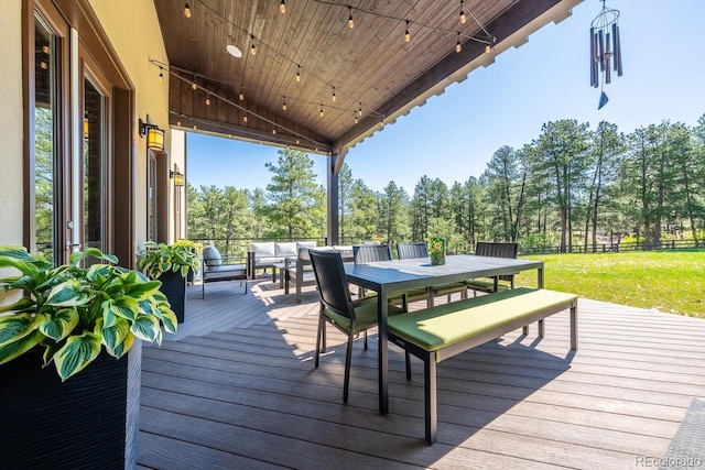 230 S Big Meadow Trl, Franktown, CO 80116 - wooden terrace with outdoor dining space, view of wooded area, and a yard