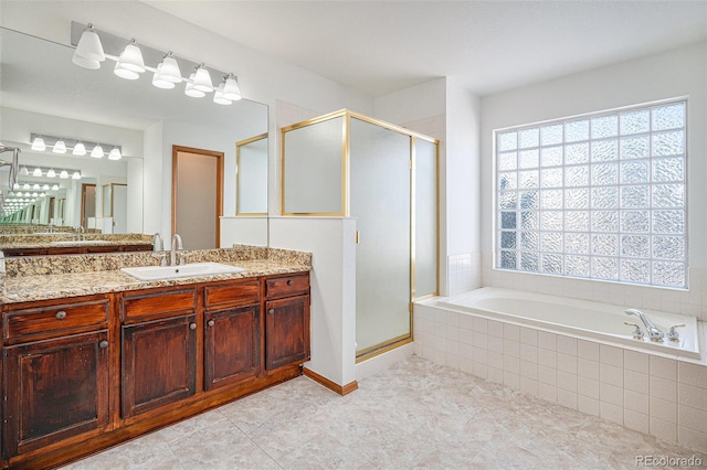 bathroom with vanity, independent shower and bath, and tile patterned flooring