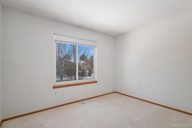 unfurnished room with carpet floors