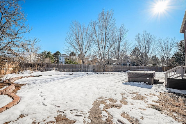 view of yard layered in snow