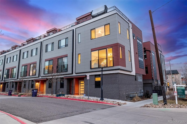 2350 Tremont Pl Unit 13, Denver, CO 80205 - view of property at dusk