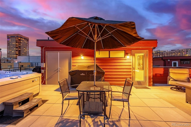 2350 Tremont Pl Unit 13, Denver, CO 80205 - view of patio / terrace featuring a hot tub, outdoor dining area, a city view, and area for grilling