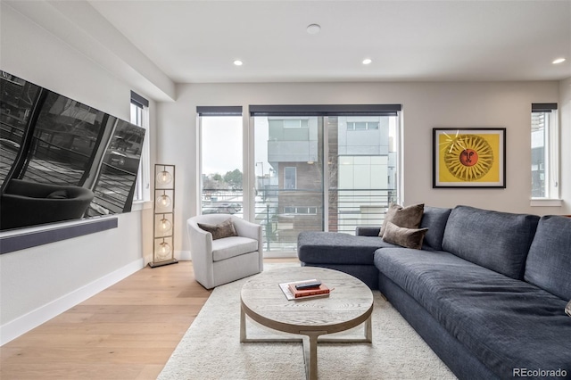 2350 Tremont Pl Unit 13, Denver, CO 80205 - living area with light wood-style flooring and recessed lighting