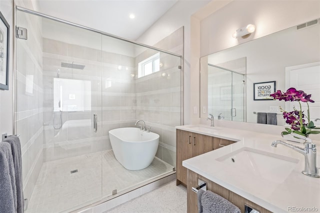 2350 Tremont Pl Unit 13, Denver, CO 80205 - bathroom featuring vanity, a shower stall, a soaking tub, and speckle patterned floor
