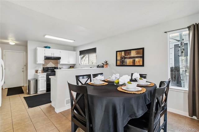 5425 W 115th Pl, Westminster, CO 80020 - dining area featuring light tile patterned flooring and baseboards