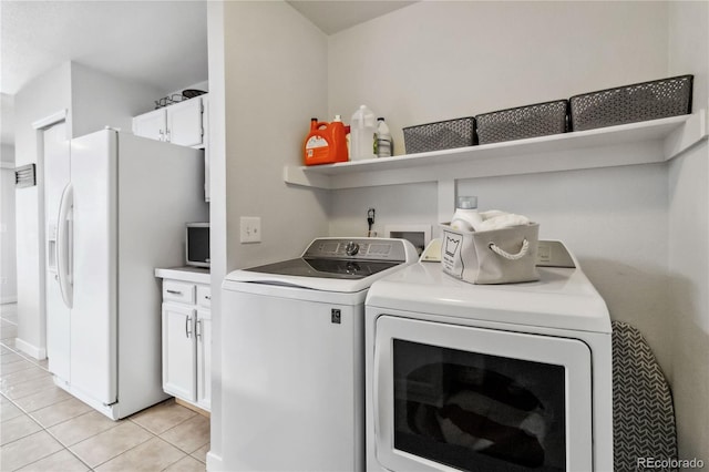 5425 W 115th Pl, Westminster, CO 80020 - washroom with washer and dryer, light tile patterned flooring, and cabinet space