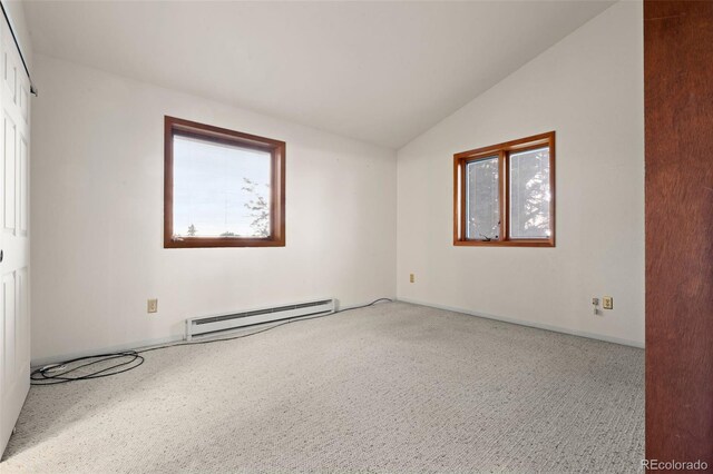 723 Brussels Dr, Parker, CO 80138 - unfurnished room with a baseboard heating unit, vaulted ceiling, and carpet