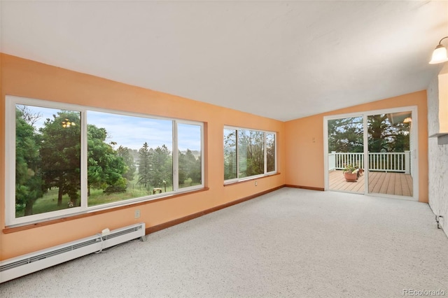 723 Brussels Dr, Parker, CO 80138 - carpeted empty room featuring a baseboard heating unit, vaulted ceiling, and healthy amount of natural light