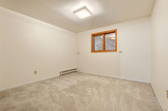 723 Brussels Dr, Parker, CO 80138 - spare room featuring a baseboard radiator and light colored carpet