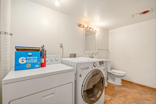 723 Brussels Dr, Parker, CO 80138 - washroom featuring separate washer and dryer and baseboards