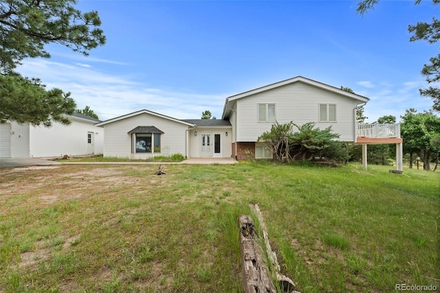 723 Brussels Dr, Parker, CO 80138 - back of property featuring a lawn, french doors, and a wooden deck