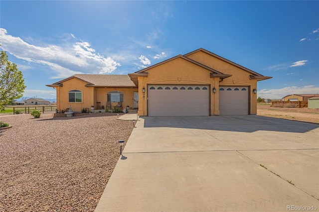 ranch-style house featuring a garage