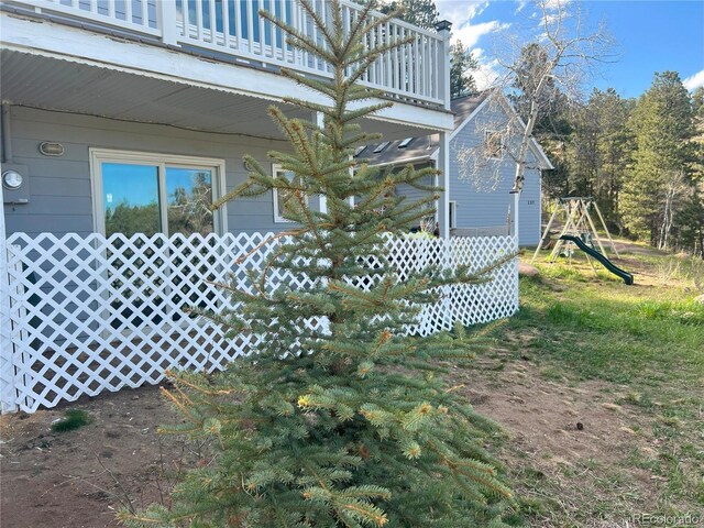 137 Bob Cat Trl, Bailey, CO 80421 - view of side of home featuring a balcony and a playground
