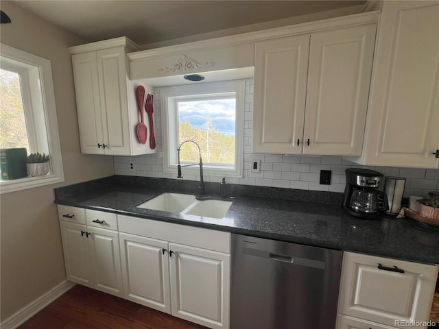 137 Bob Cat Trl, Bailey, CO 80421 - kitchen with stainless steel dishwasher, a sink, dark countertops, and decorative backsplash